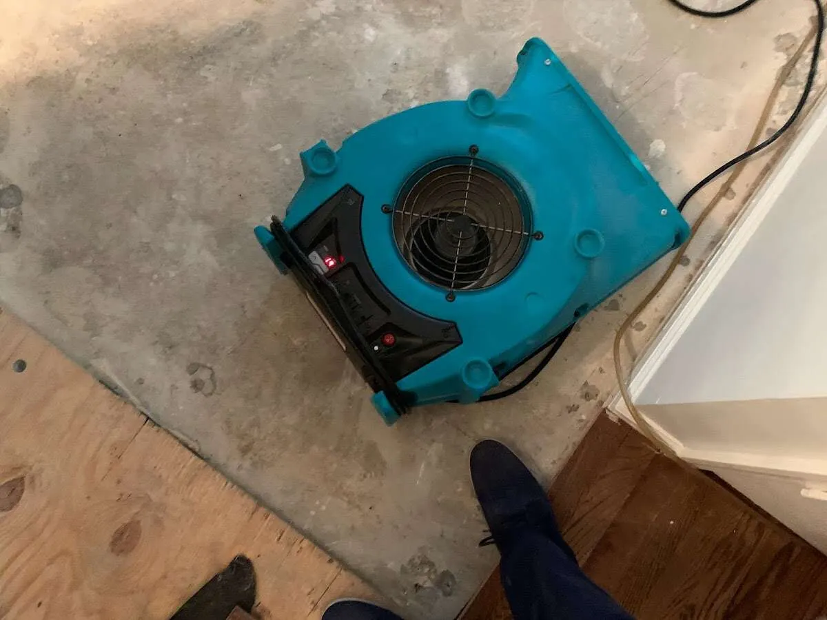 Air mover drying subfloor during Leak Detection & Repair in Lone Tree